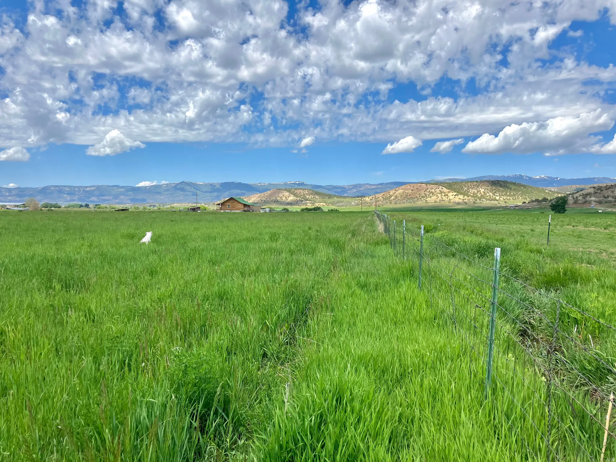 View of mountain background featuring rural landscape