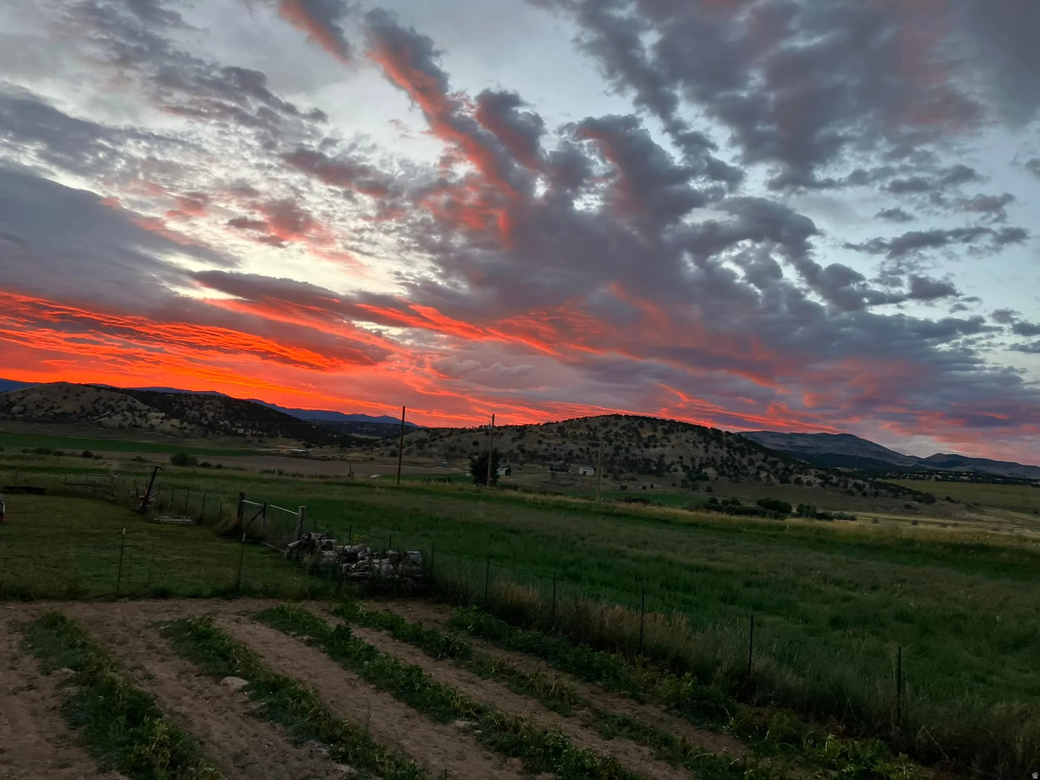 View of mountain backdrop featuring rural landscape