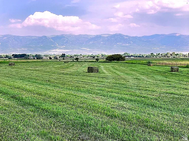 View of mountain background with rural landscape and agricultural land