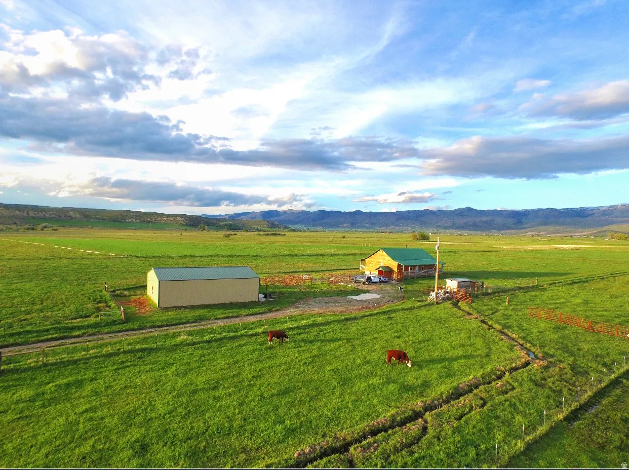 View of rural area featuring a pastoral area and a mountain backdrop