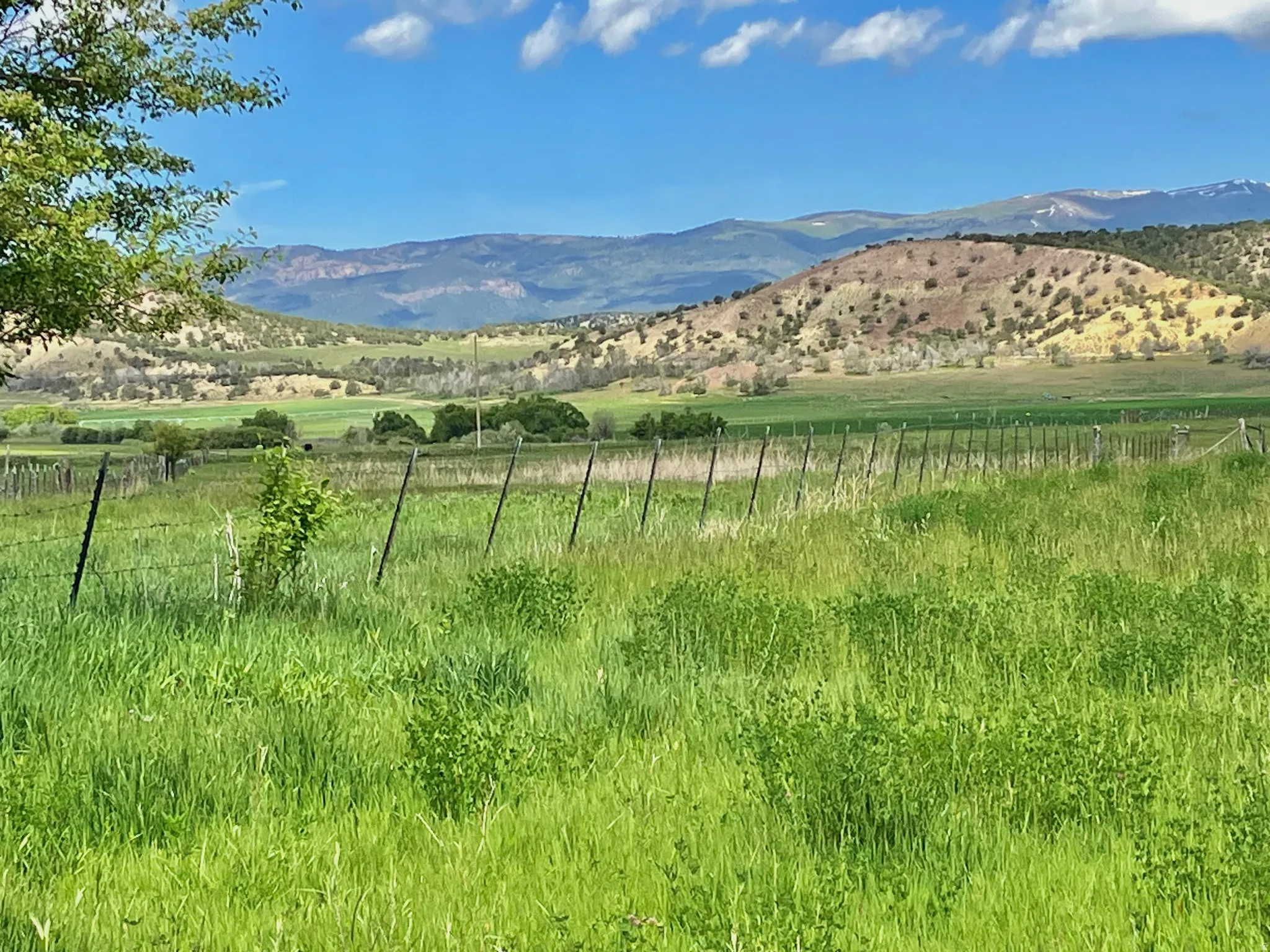 View of mountain background featuring rural landscape
