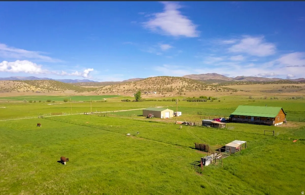 Overview of rural landscape featuring a mountain backdrop