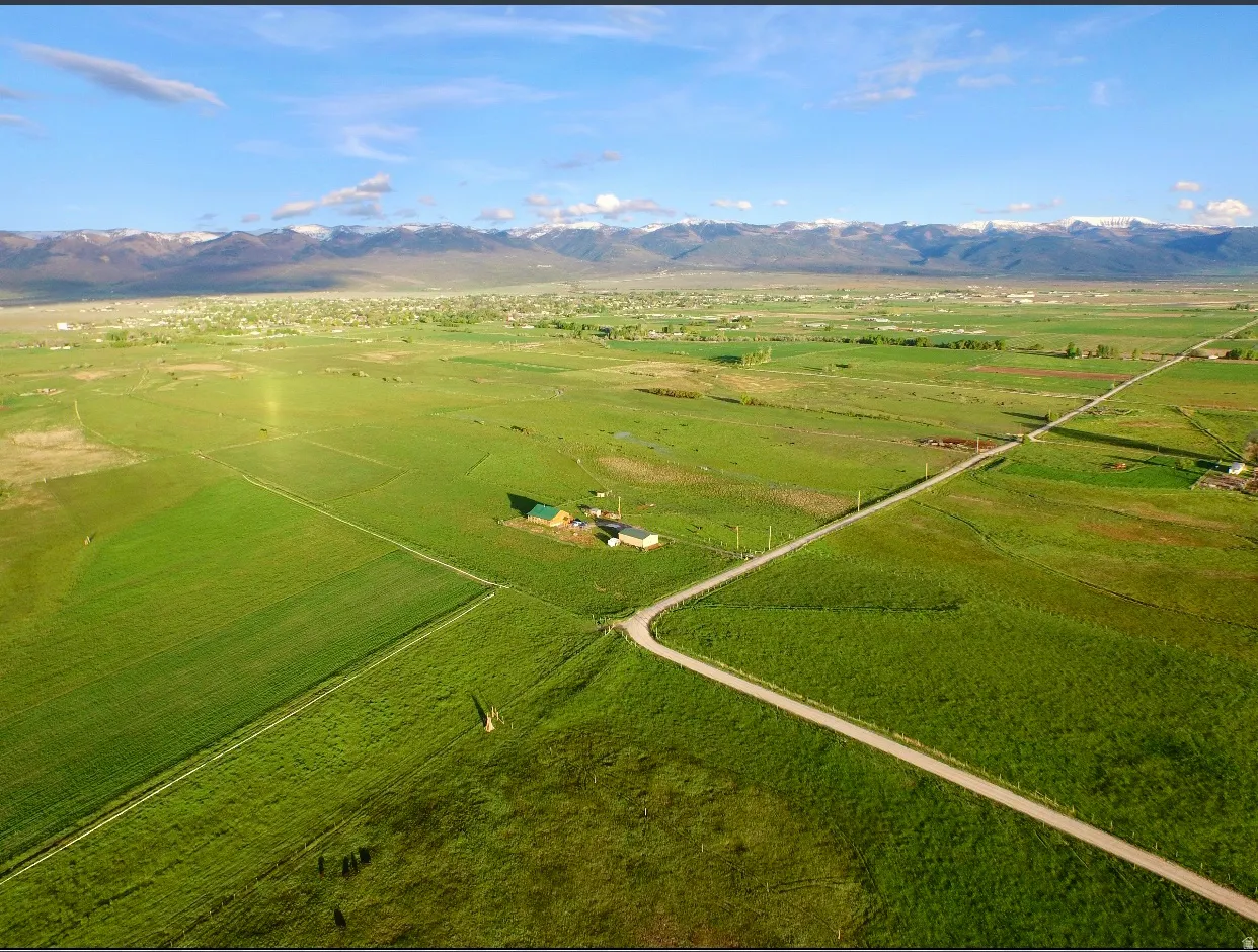 Aerial view of sparsely populated area with a mountain backdrop