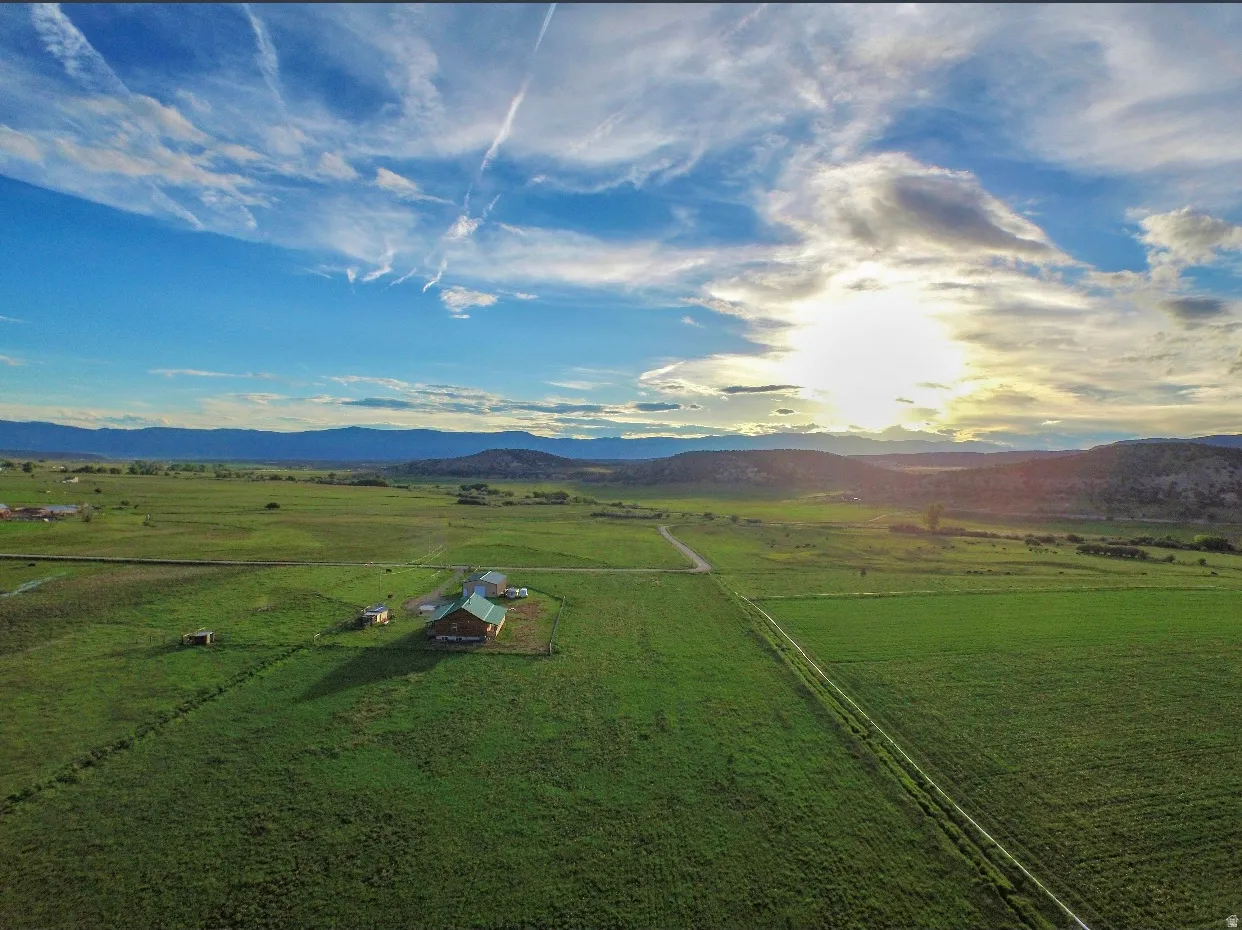 View of mountain background featuring rural landscape and agricultural land