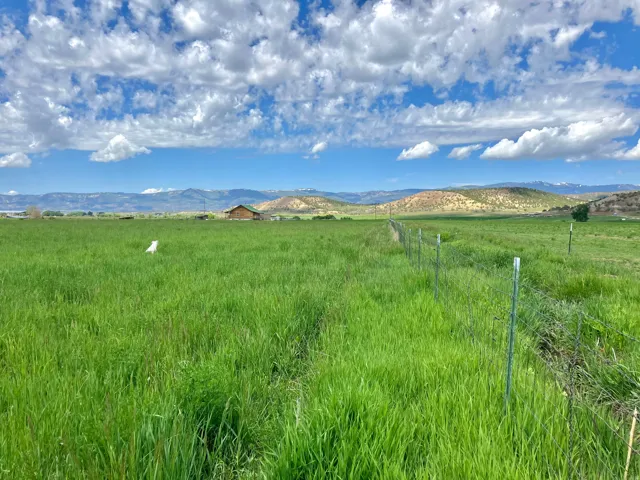 View of mountain background featuring rural landscape