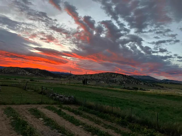 View of mountain backdrop featuring rural landscape