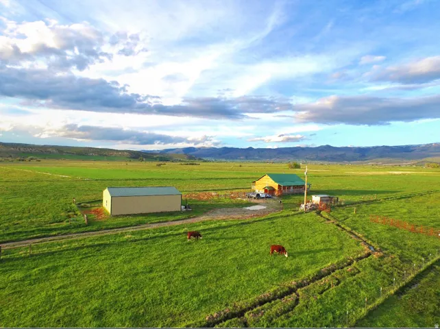 View of rural area featuring a pastoral area and a mountain backdrop