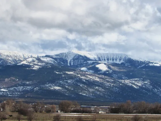 View of mountain background featuring rural landscape
