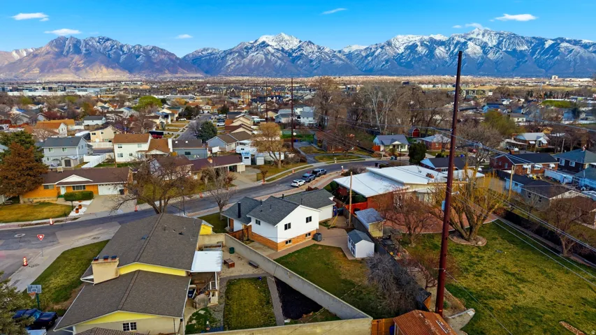 Aerial perspective of suburban area featuring a mountainous background