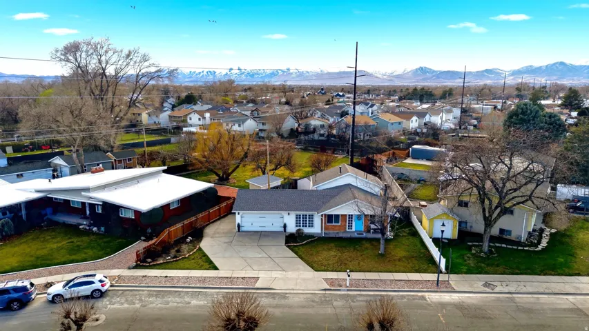 Aerial perspective of suburban area with a mountain backdrop