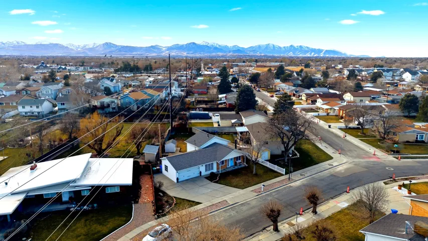 Aerial view of residential area with a mountainous background
