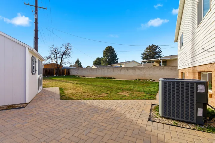 Fenced backyard featuring a patio