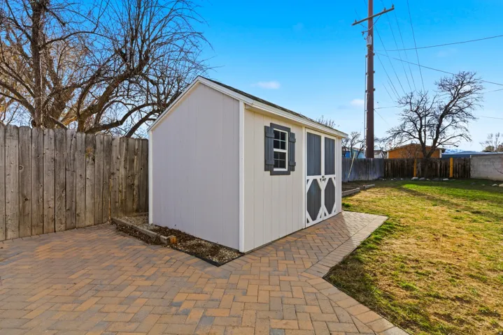 View of shed featuring a fenced backyard