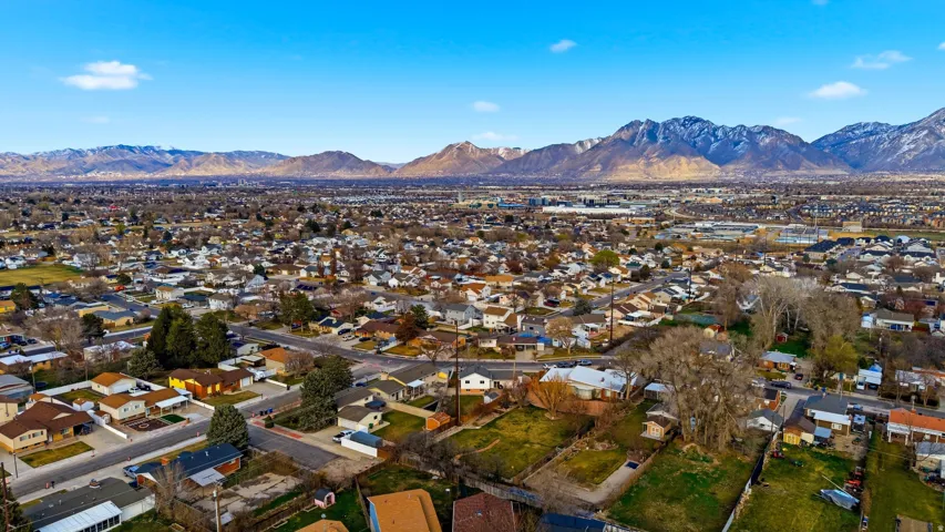 Aerial perspective of suburban area with a mountainous background