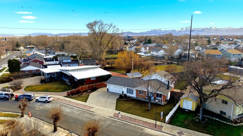 Aerial perspective of suburban area with a mountainous background