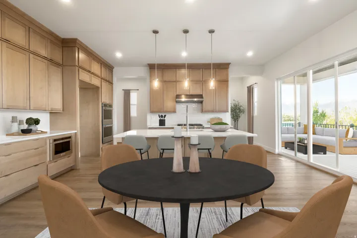 Modern kitchen featuring light wood cabinetry, white countertops, a large island with seating, a built-in microwave, and double wall ovens