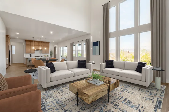 Living area featuring a two-story ceiling and expansive windows