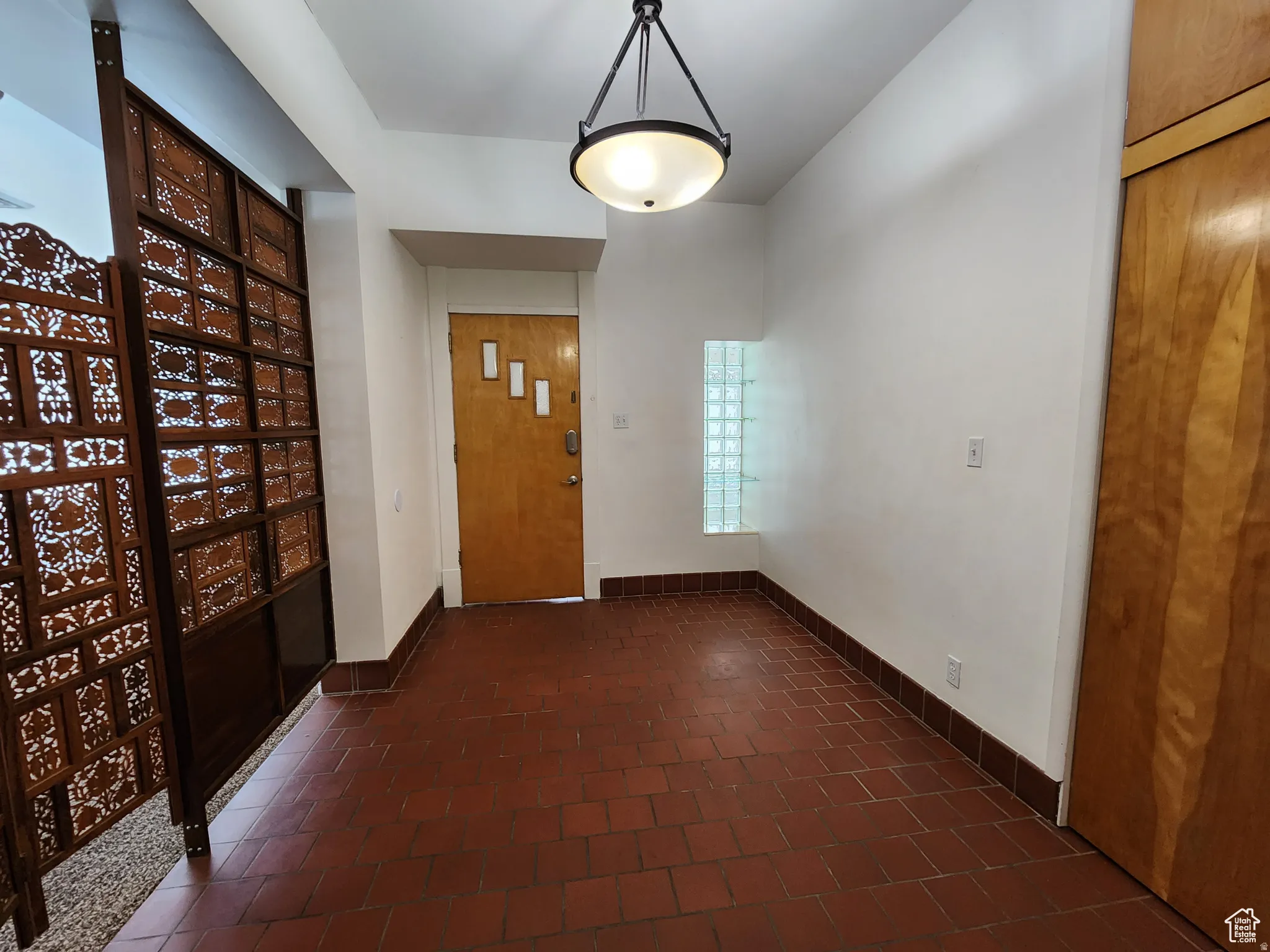 #1 Private Foyer with brick floors and baseboards