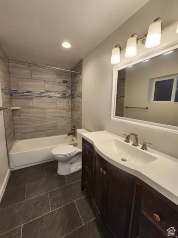 #1 Primary suite Private Bathroom featuring vanity, tub / shower combination, and recessed lighting