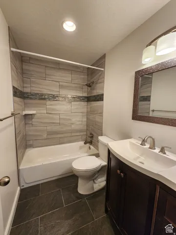 #1 Main bathroom featuring vanity and shower / tub combination