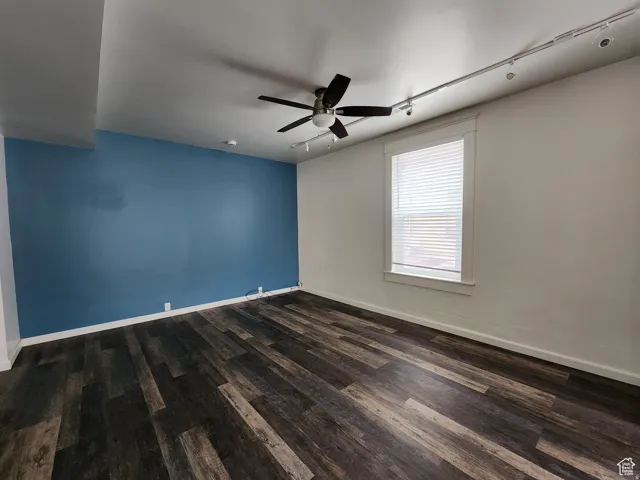 #1 Dining area off Living Room track lighting, dark wood finished floors, and ceiling fan