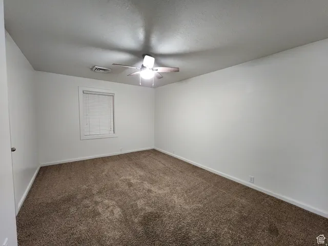 #1 bedroom two, featuring carpet, and ceiling fan