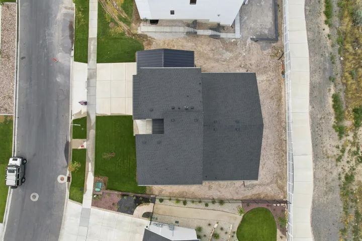 Dark shingle roofing with a multi-pitch design