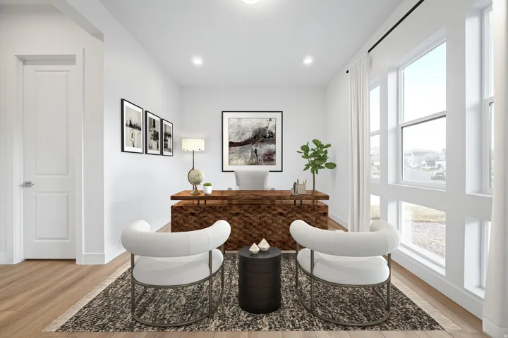 Dedicated office space featuring expansive window panels, recessed lighting, wood-finish flooring, a solid panel door, and crisp white walls