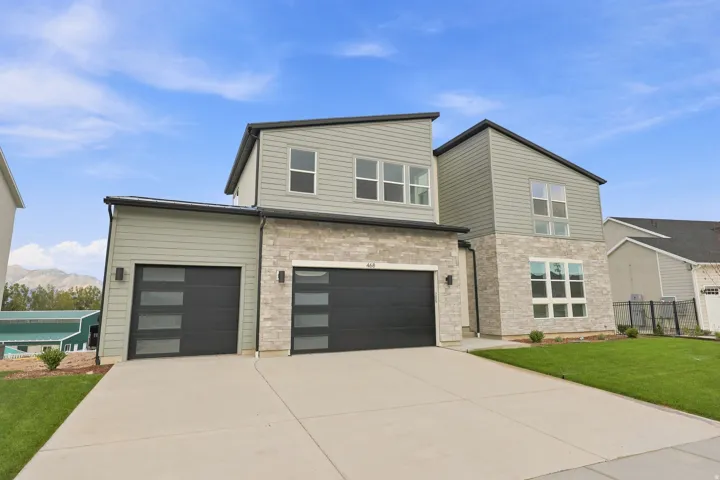 Contemporary exterior with stone facade accents and horizontal siding