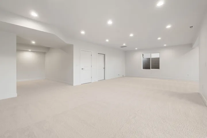 Basement featuring light carpet and recessed lighting