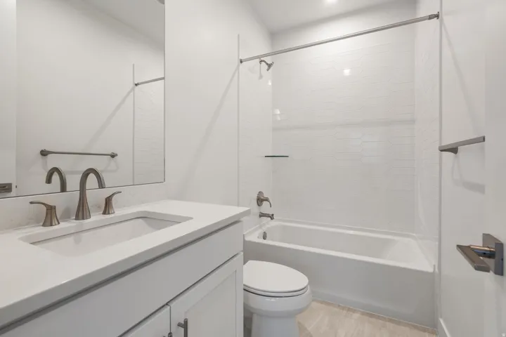 Bathroom with vanity and shower / tub combination