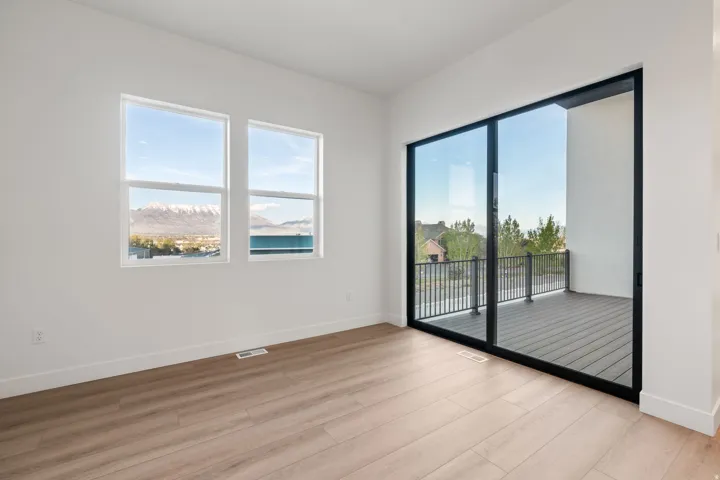 Spare room featuring light wood-style floors
