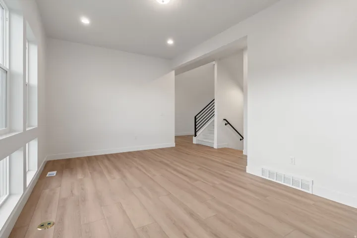 Spare room featuring light wood-style floors and recessed lighting