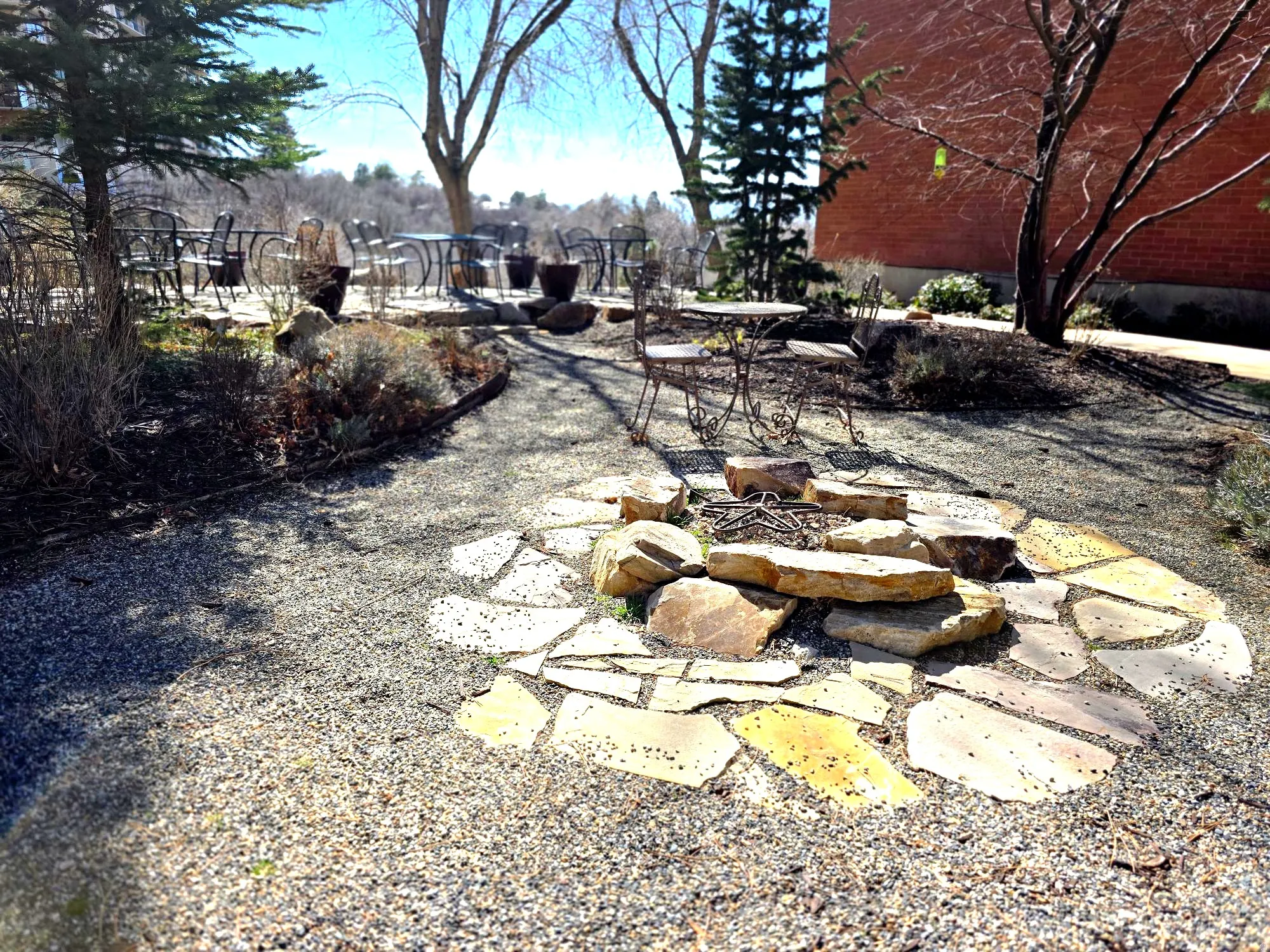 View of yard with an outdoor fire pit and a patio