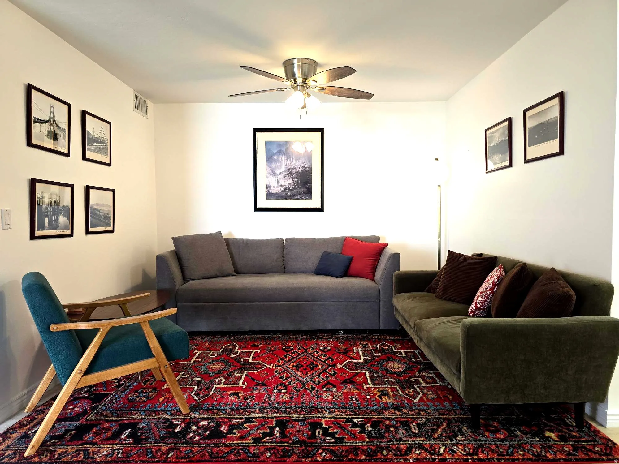 Living room with ceiling fan and baseboards