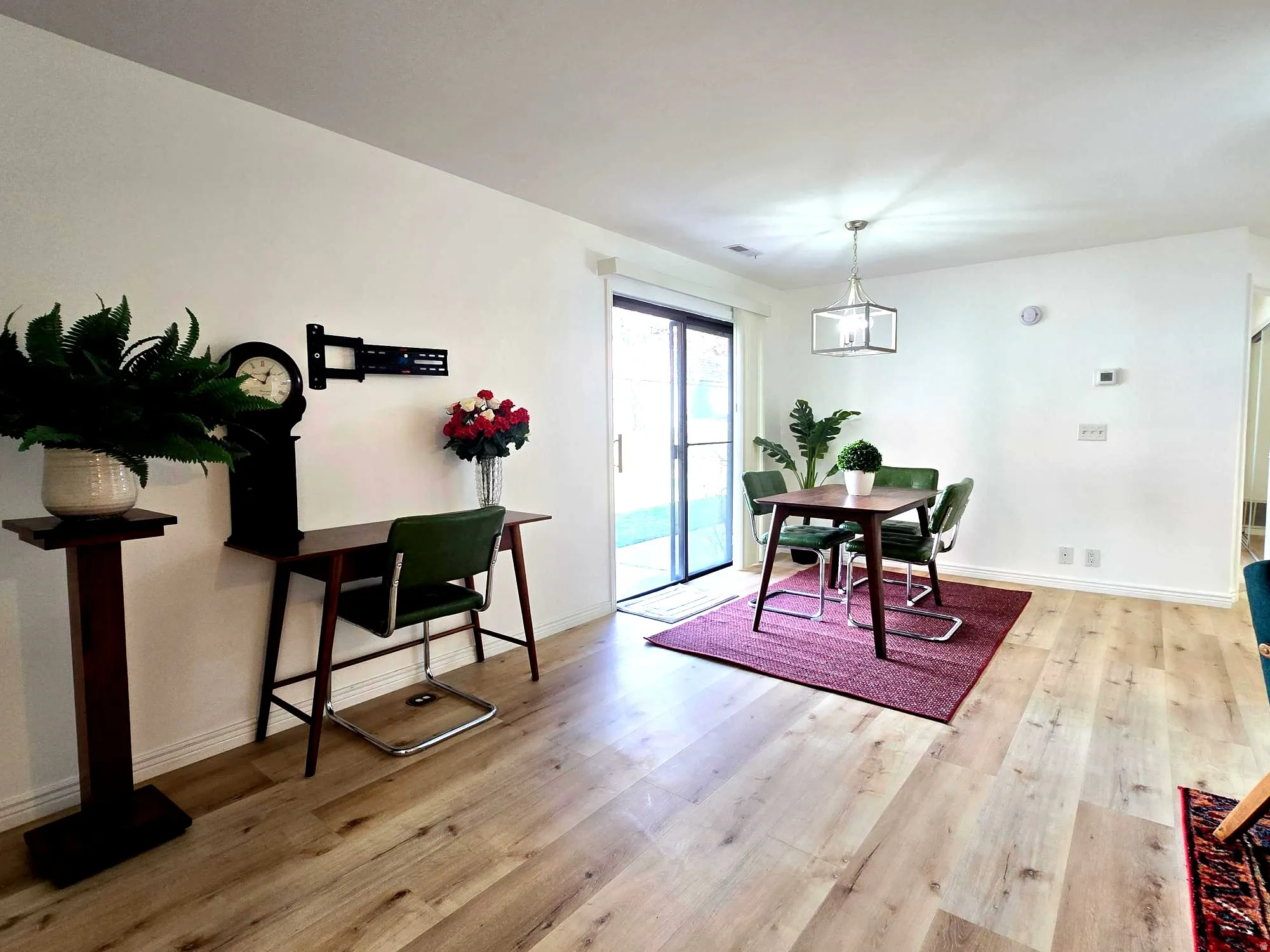 Dining room with desk area to the left. a