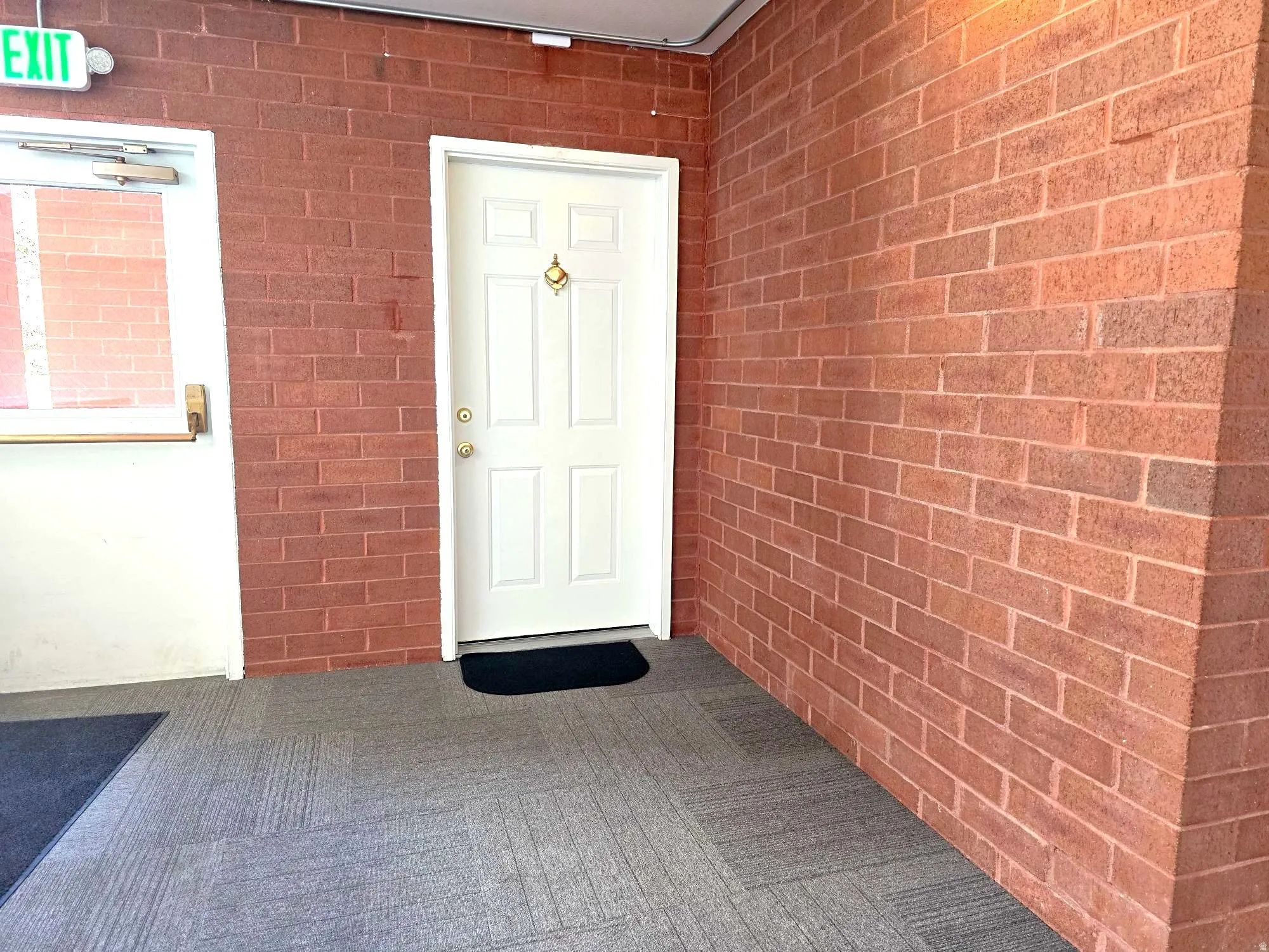 Front doorway to condo from common hallway.