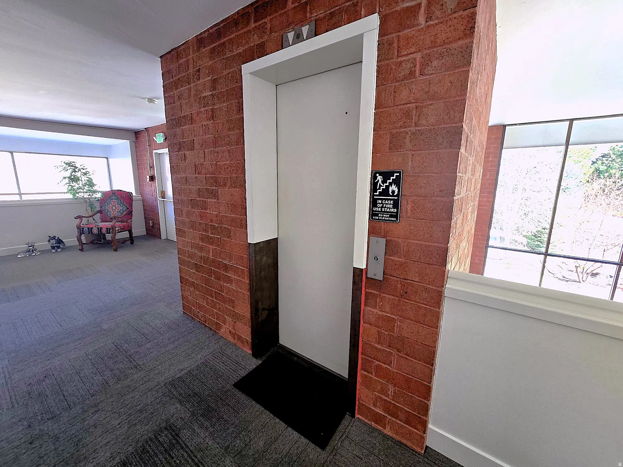 Property entrance featuring elevator