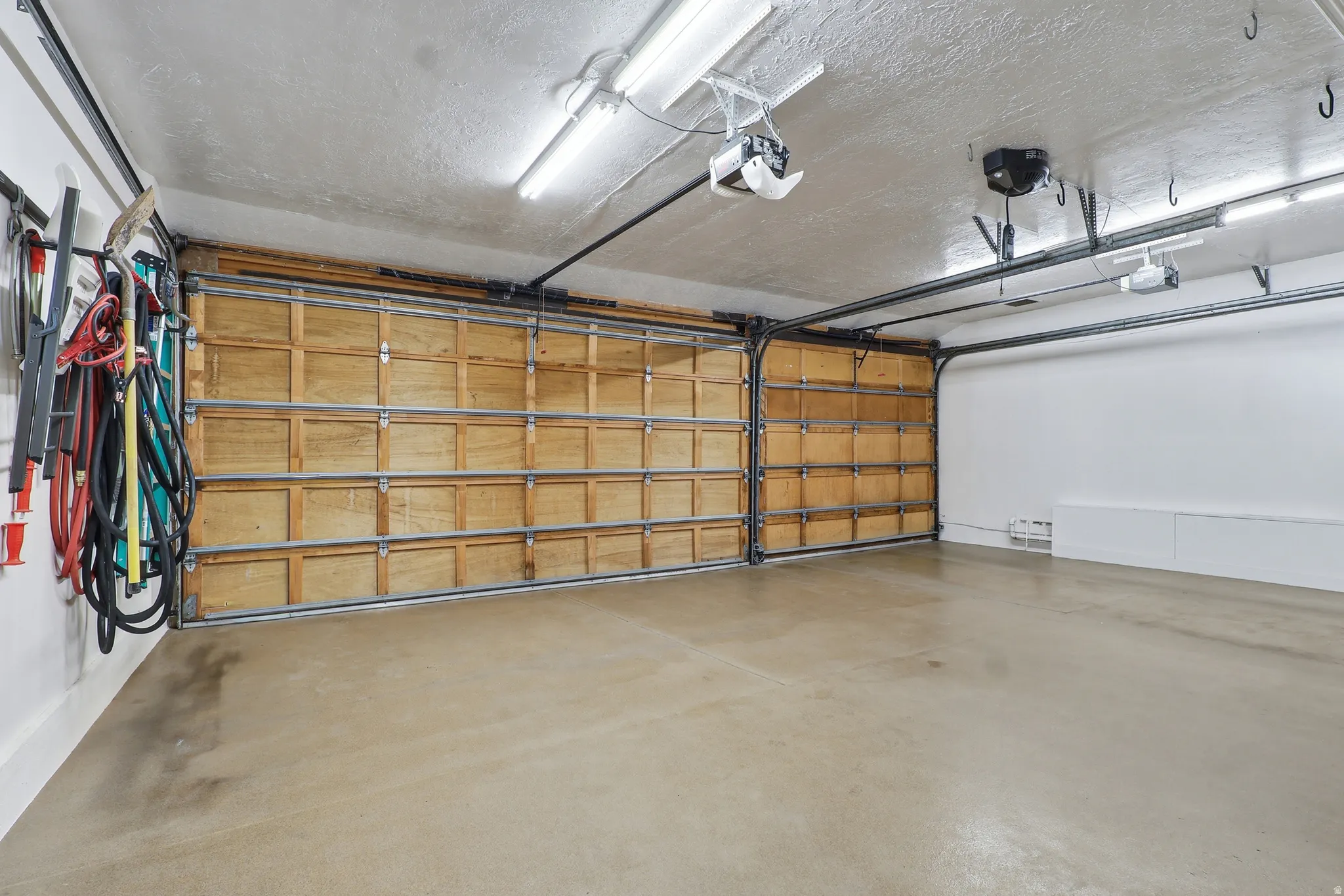 Garage featuring a garage door opener