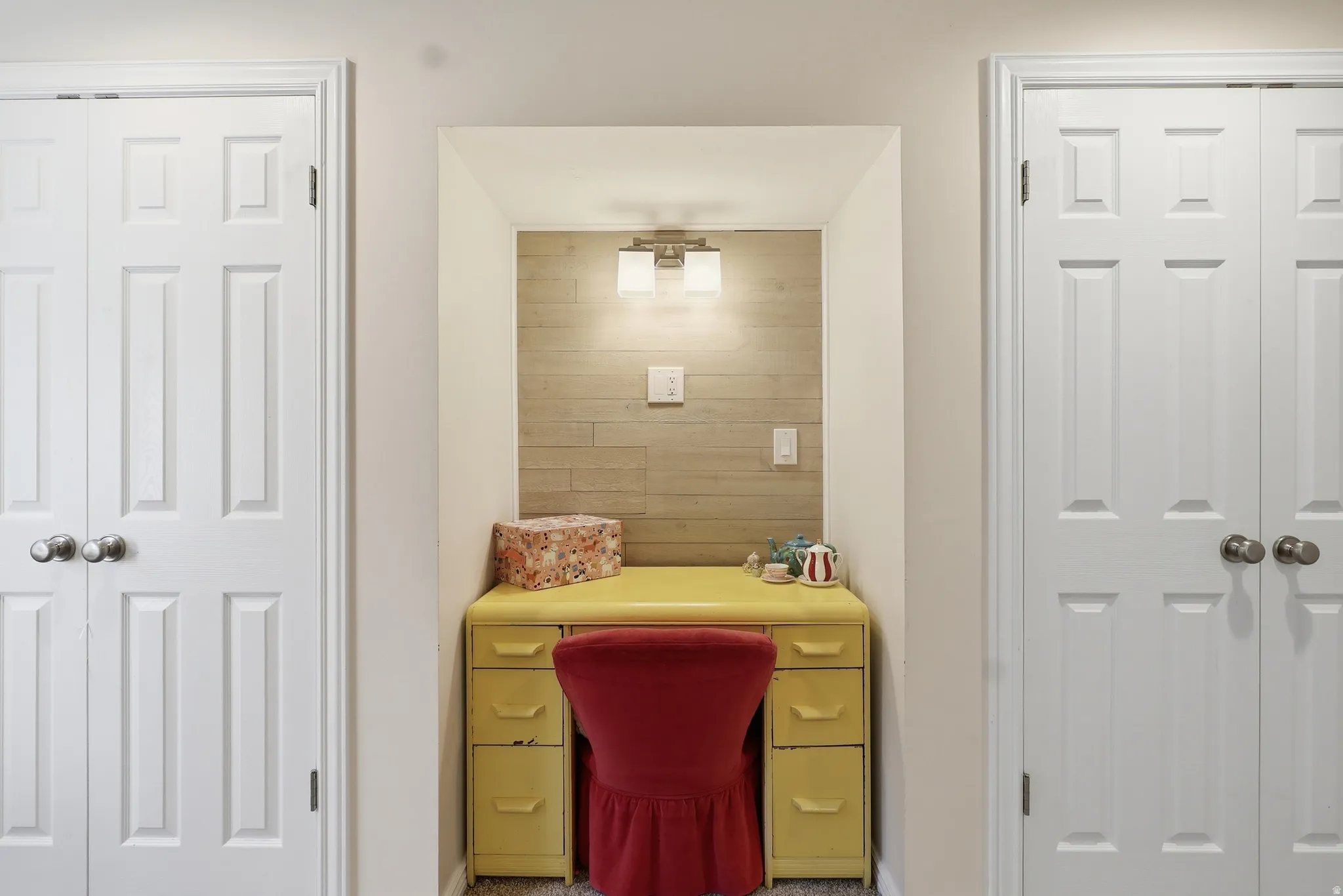 Home office featuring wood walls and baseboards