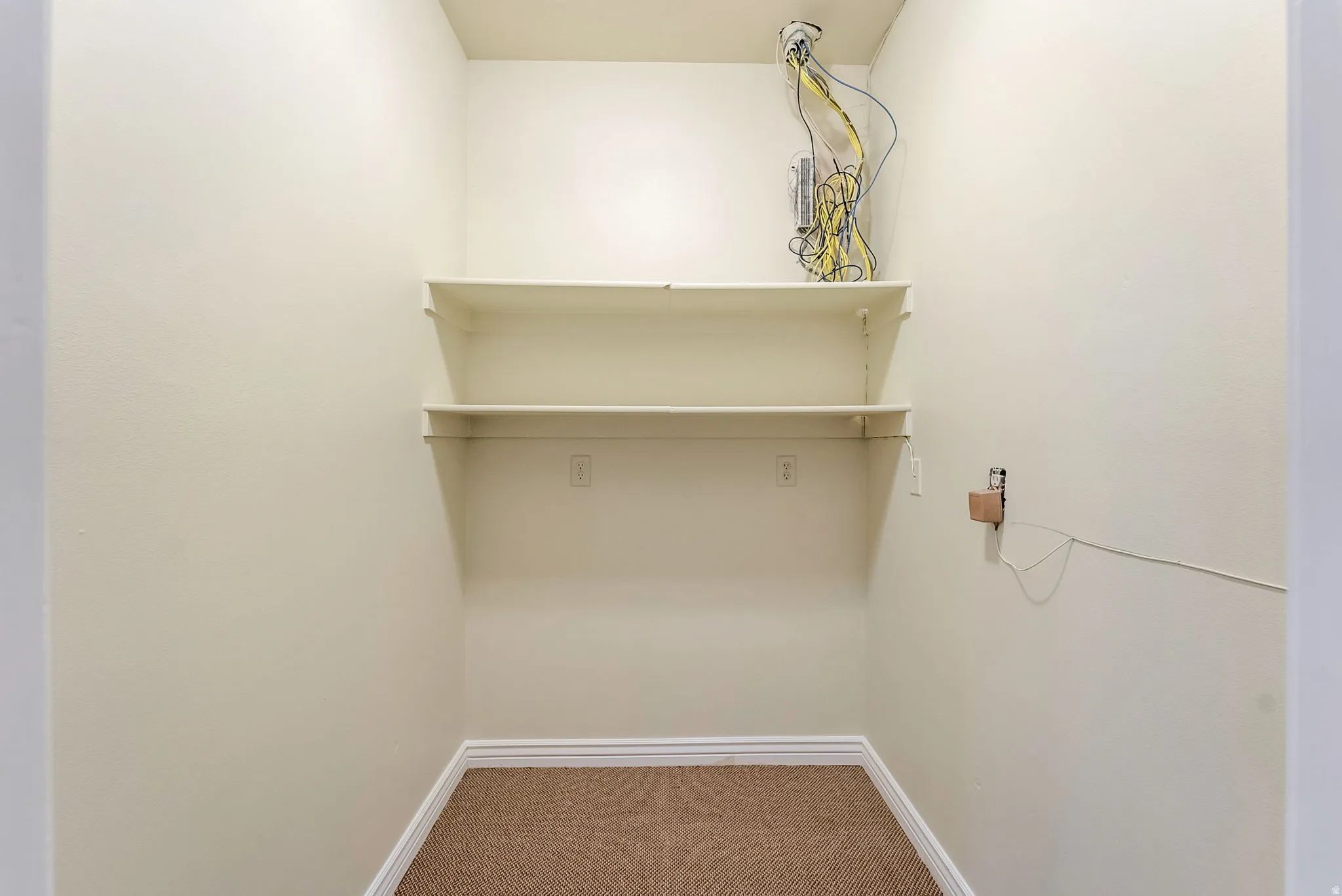 Walk-in closet for storage and communications hub.