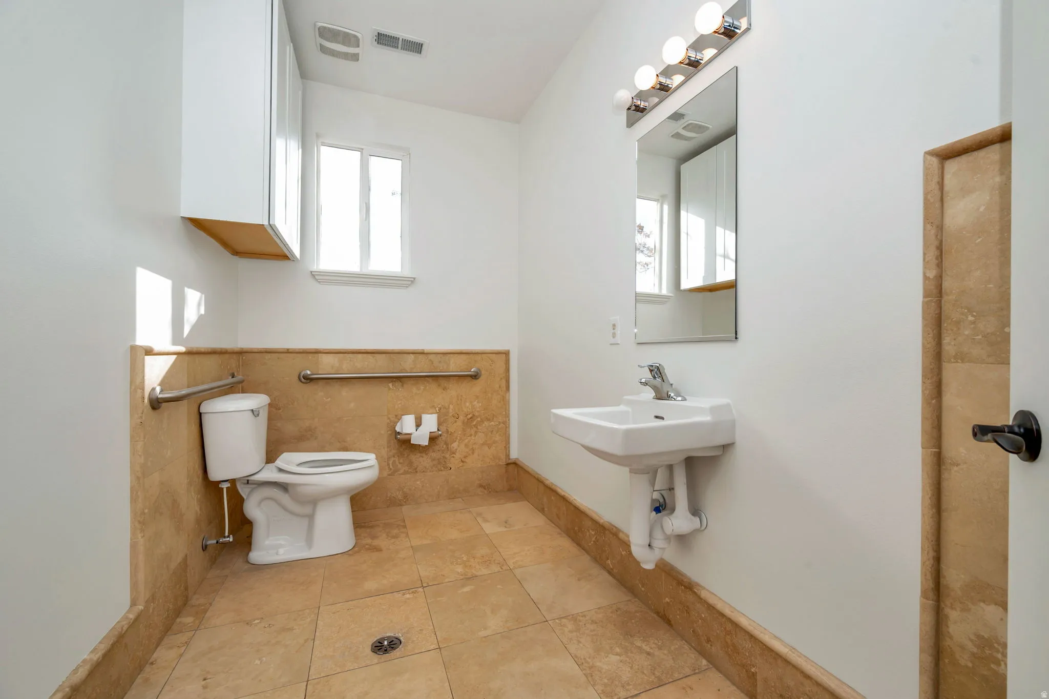 Bathroom featuring healthy amount of natural light