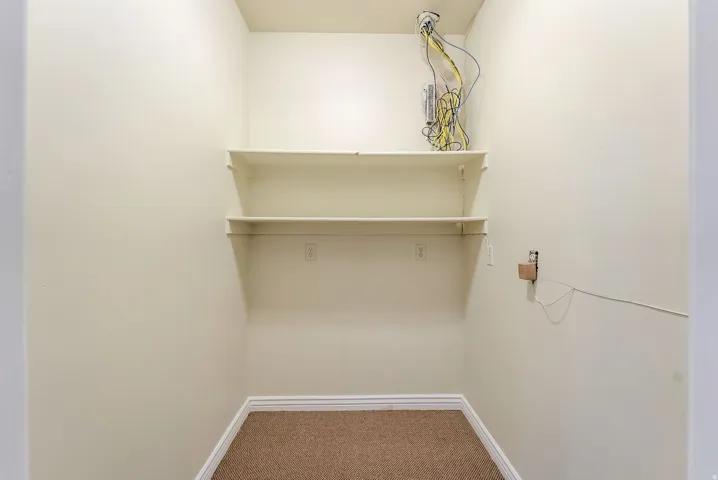 Walk-in closet for storage and communications hub.