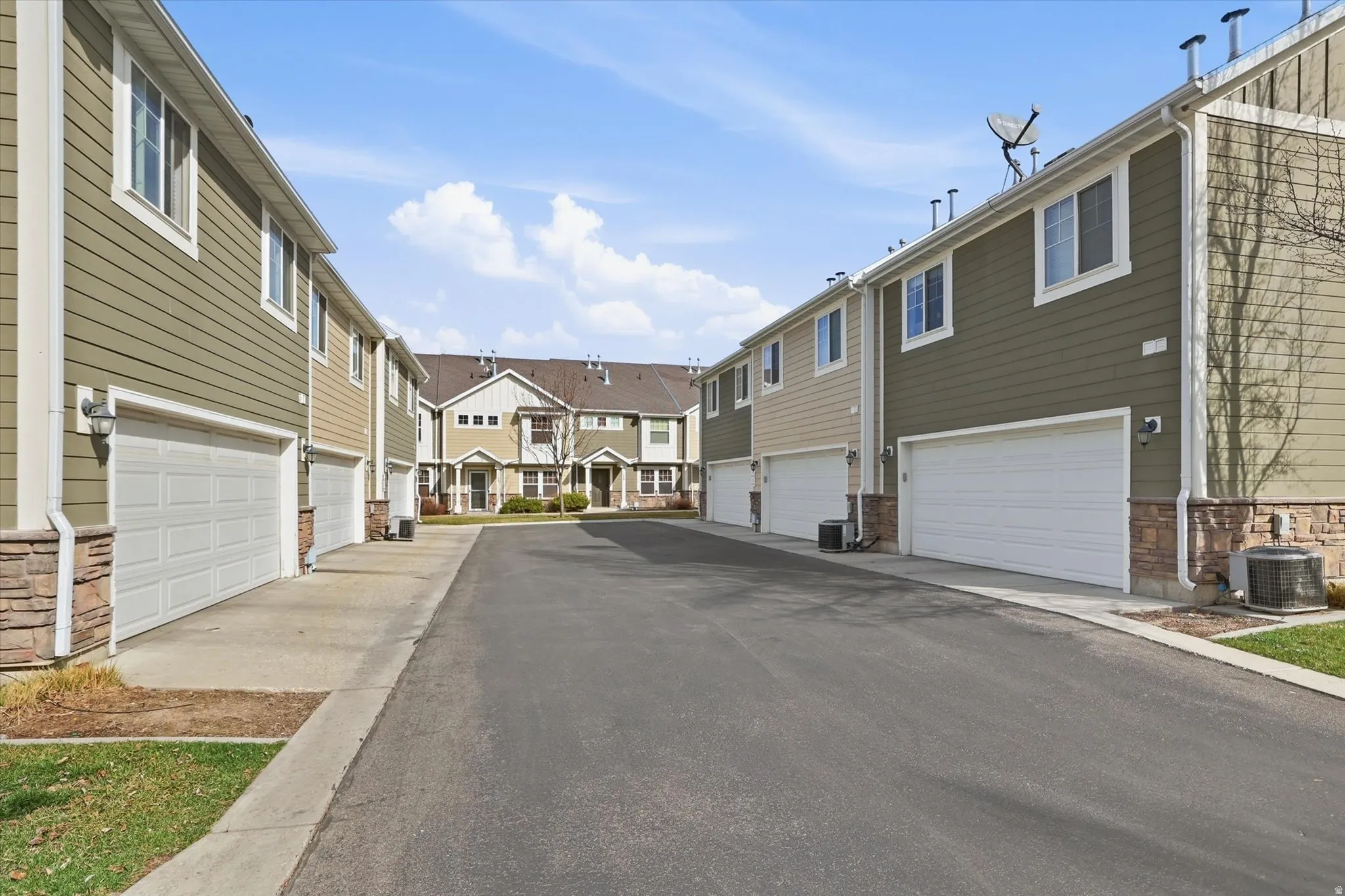 View of asphalt road featuring a residential view