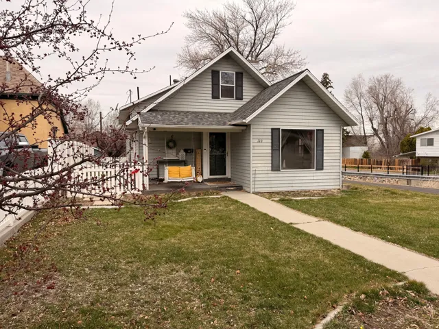 Bungalow with roof with shingles and a porch