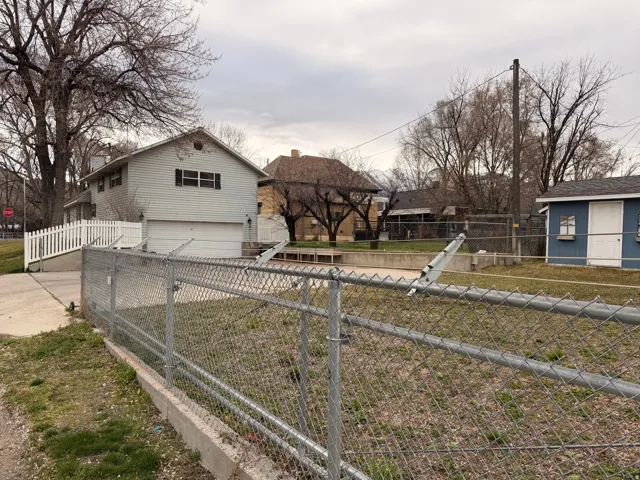 View of front of home with an attached garage and concrete driveway