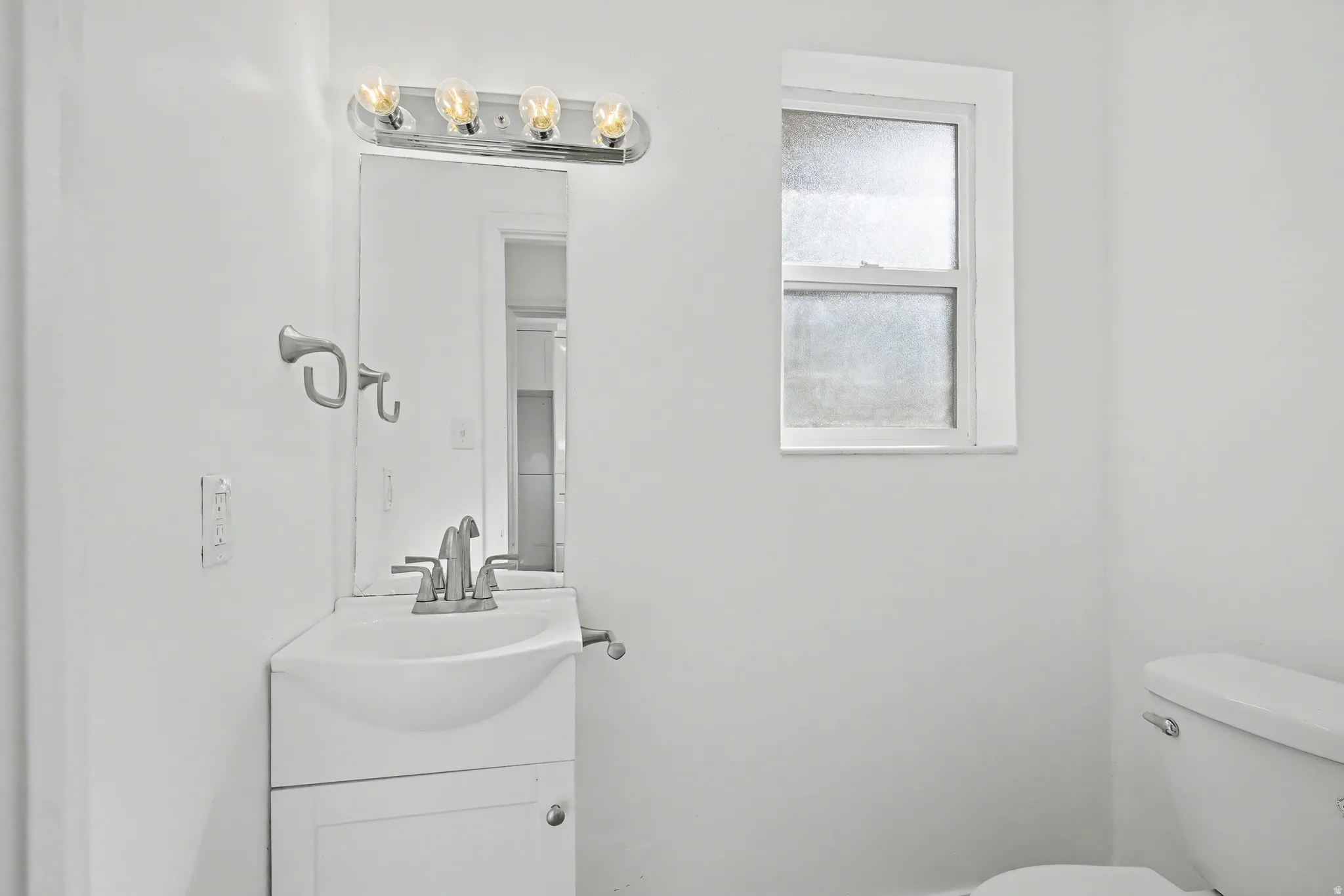 Bathroom with vanity and toilet