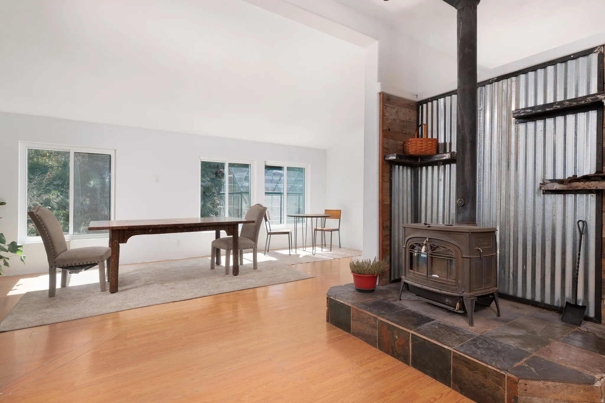 Interior space featuring  light wood-style floors and a wood stove