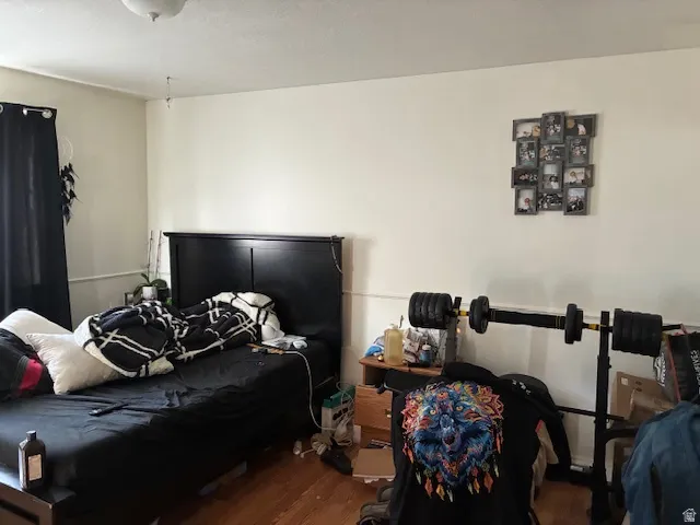 Bedroom with wood finished floors