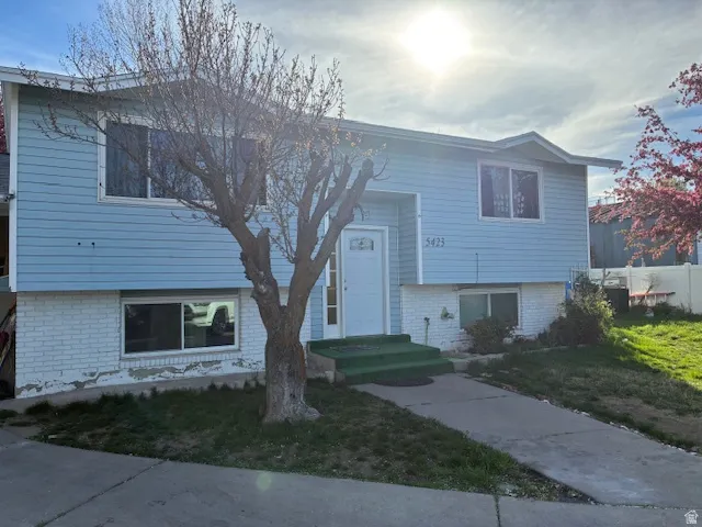 Raised ranch with brick siding